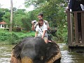 Riding Elephant in River
