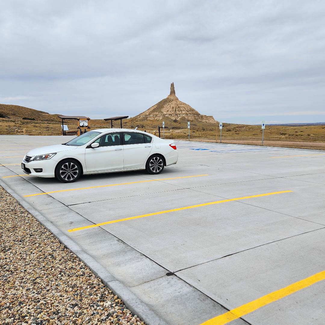 Photo Brian's Car is Parked at the Viewing Area With Chimney Rock